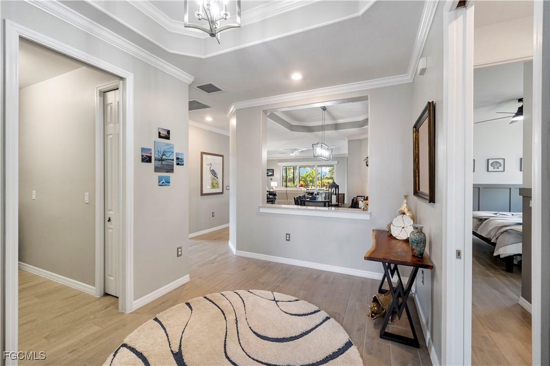 43276 Boardwalk Loop Punta Gorda, FL 33982 - Photo 6 of 50 a living room with furniture and a chandelier