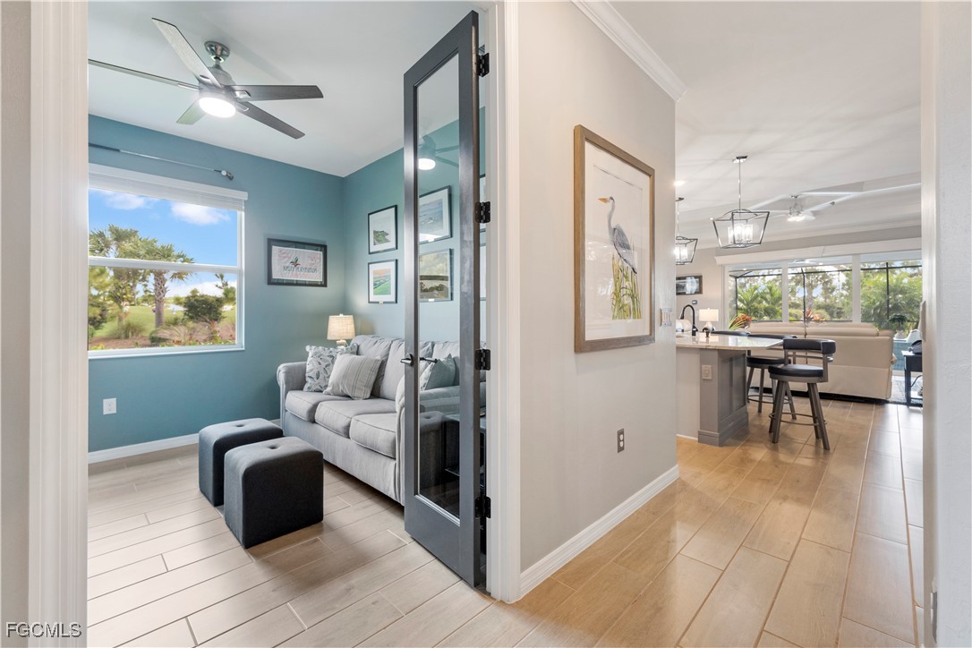 43276 Boardwalk Loop Punta Gorda, FL 33982 - Photo 7 of 50 a bedroom with furniture and a large window