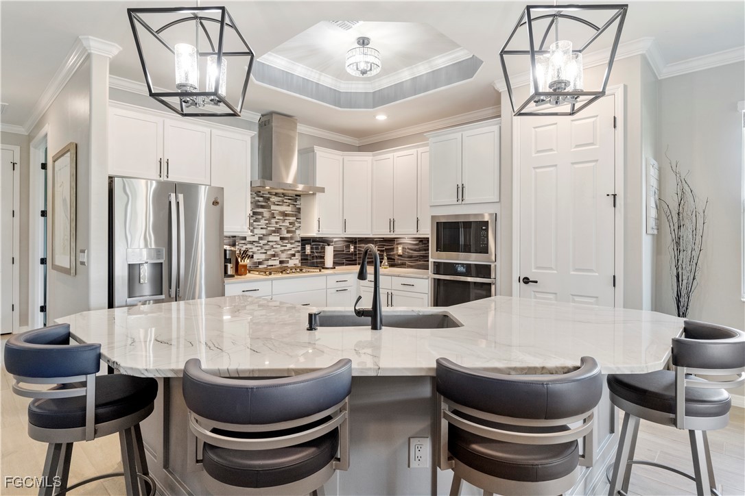 43276 Boardwalk Loop Punta Gorda, FL 33982 - Photo 10 of 50 a kitchen with a dining table and chairs