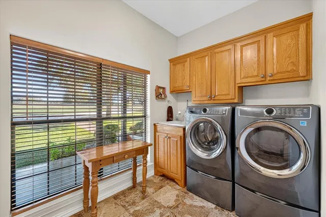 a view of a bedroom with washer and dryer