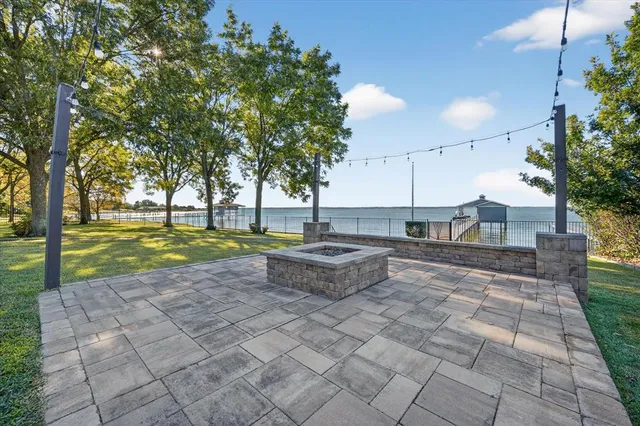 a view of a swimming pool with a yard