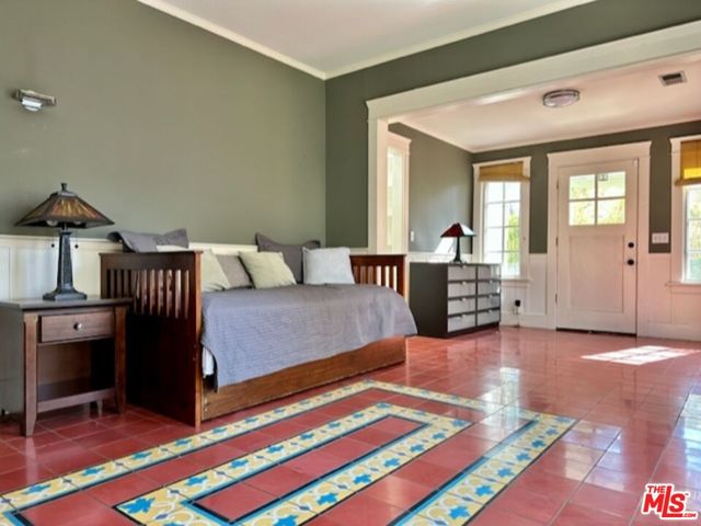 a bedroom with a bed and window