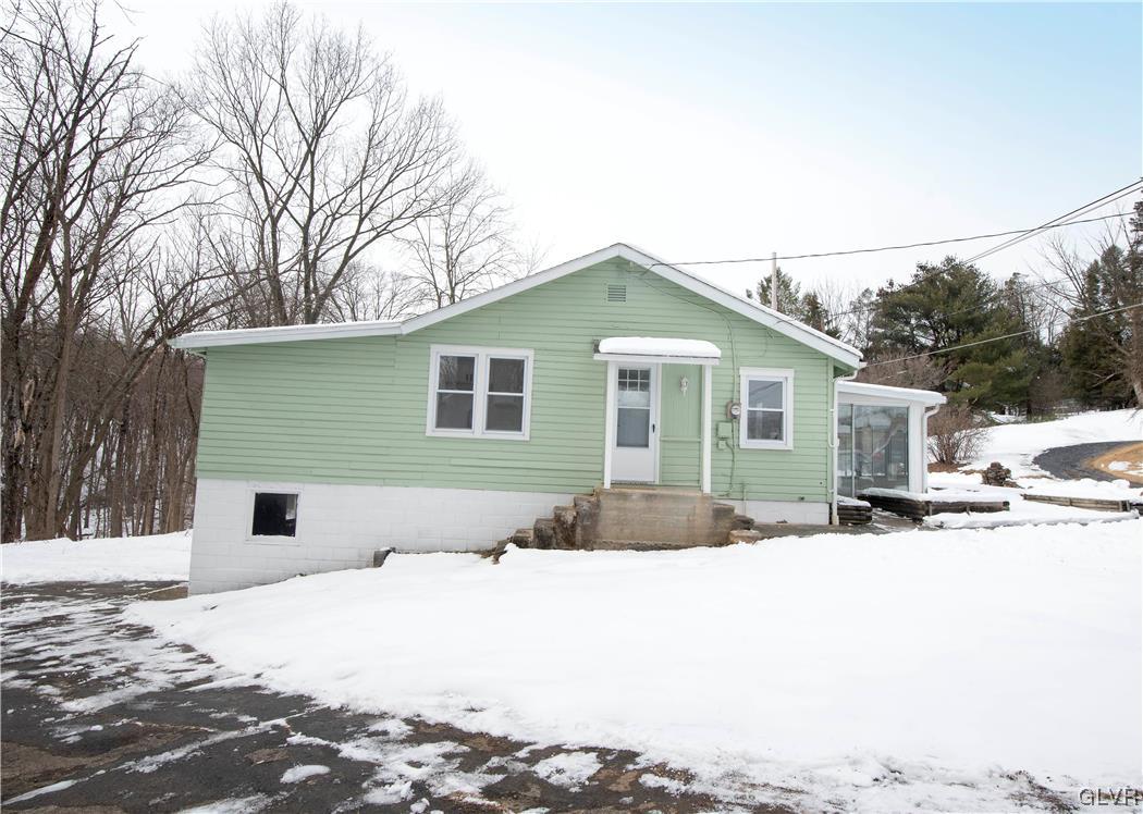 2244 Hillside Road Slatington, PA 18080 - Photo 1 of 32 a front view of house with yard and trees in the background