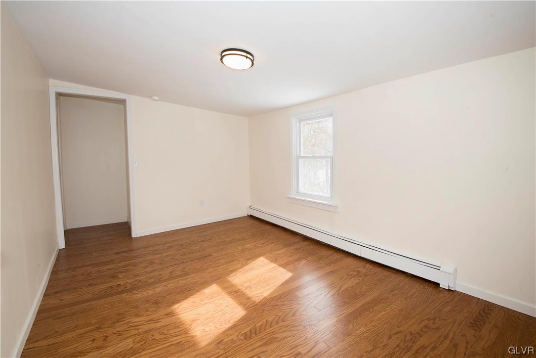 2244 Hillside Road Slatington, PA 18080 - Photo 26 of 32 a view of an empty room with wooden floor and a window