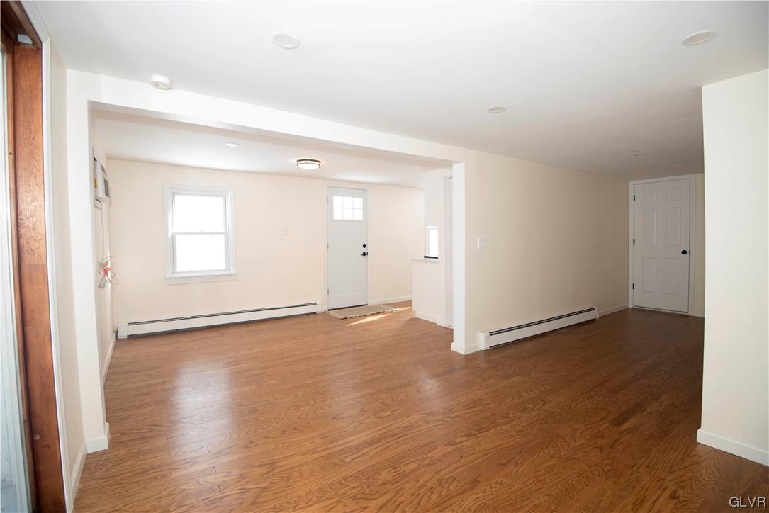 2244 Hillside Road Slatington, PA 18080 - Photo 8 of 32 an empty room with wooden floor and windows