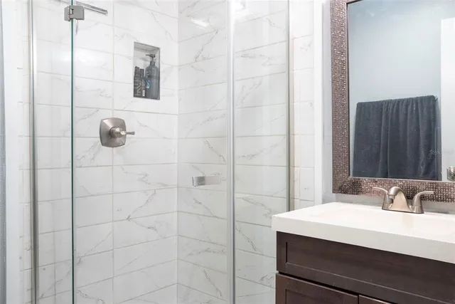 a bathroom with a sink and mirror