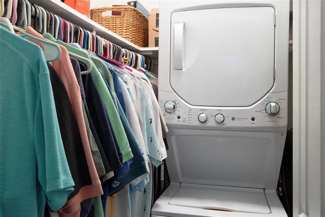 a view of a balcony with washer and dryer