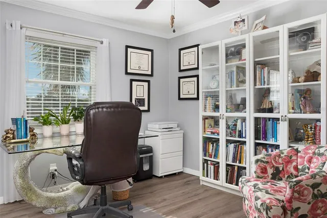 a work room with furniture and a book shelf