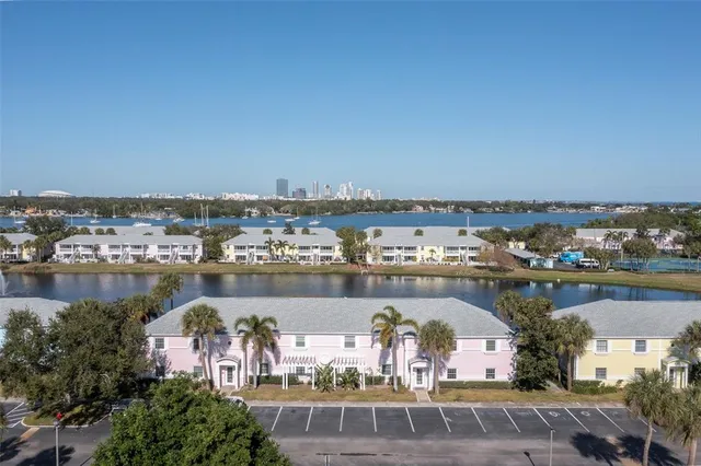 an aerial view of a house with a lake view