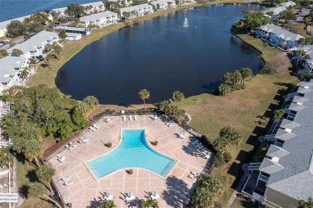 an aerial view of a house with a lake view