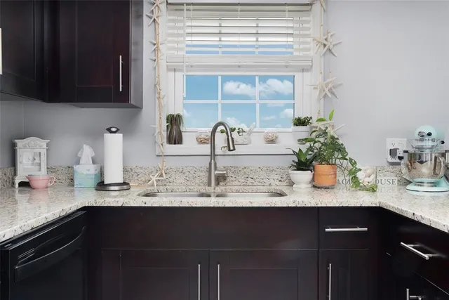 a kitchen with a sink and cabinets
