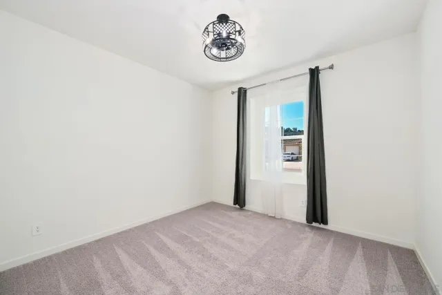 a picture of a bench in front of a wall