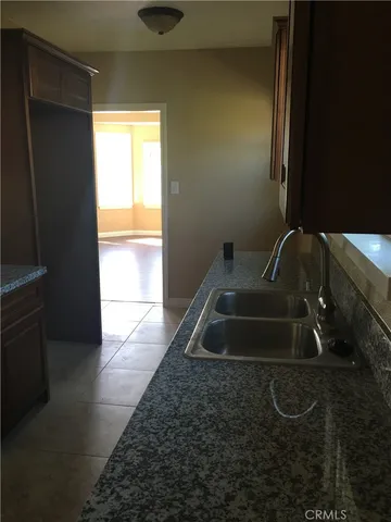a bathroom with a sink and a window