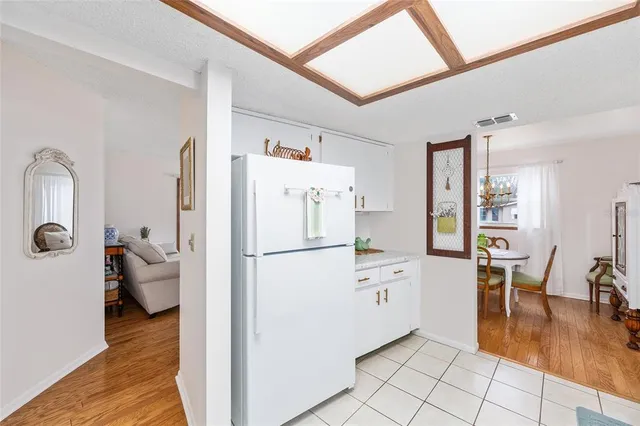a white refrigerator freezer sitting inside of a kitchen