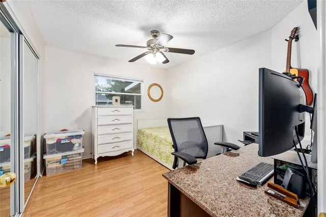 a bedroom with a workspace