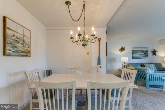 a kitchen with a refrigerator and a sink