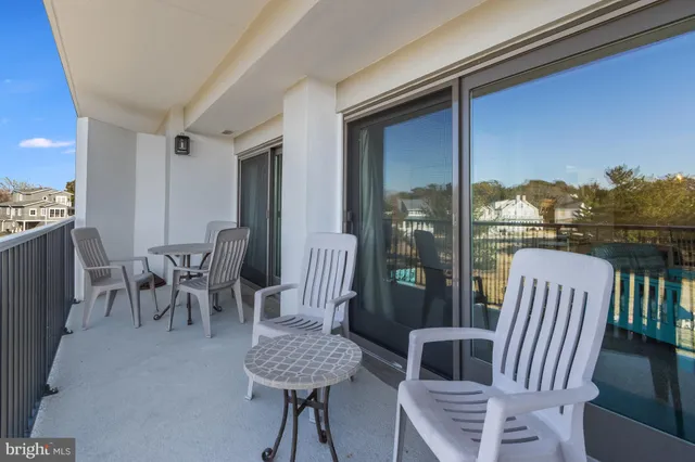 a view of a balcony with furniture