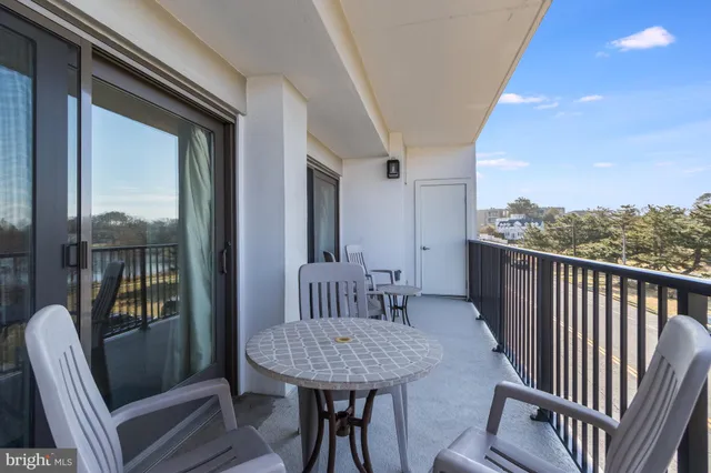 a view of a balcony with furniture