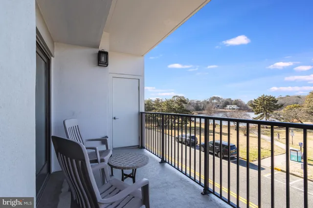 a view of a balcony with furniture
