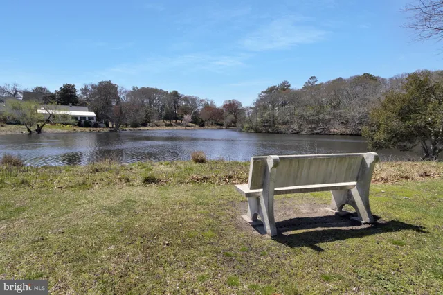 a pathway of a house with a yard