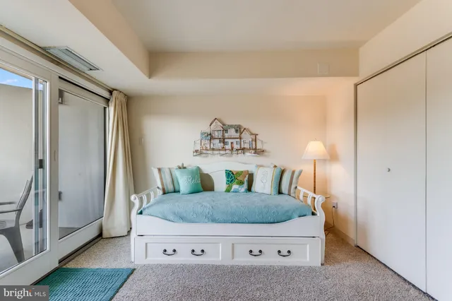 a room with furniture and a large window