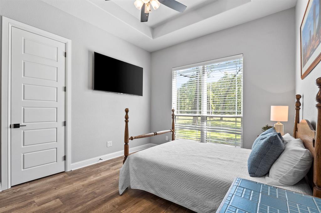 Tbd Tbd Anchor Point Quinlan, TX 75474 - Photo 21 of 40 a bedroom with a bed and a flat screen tv