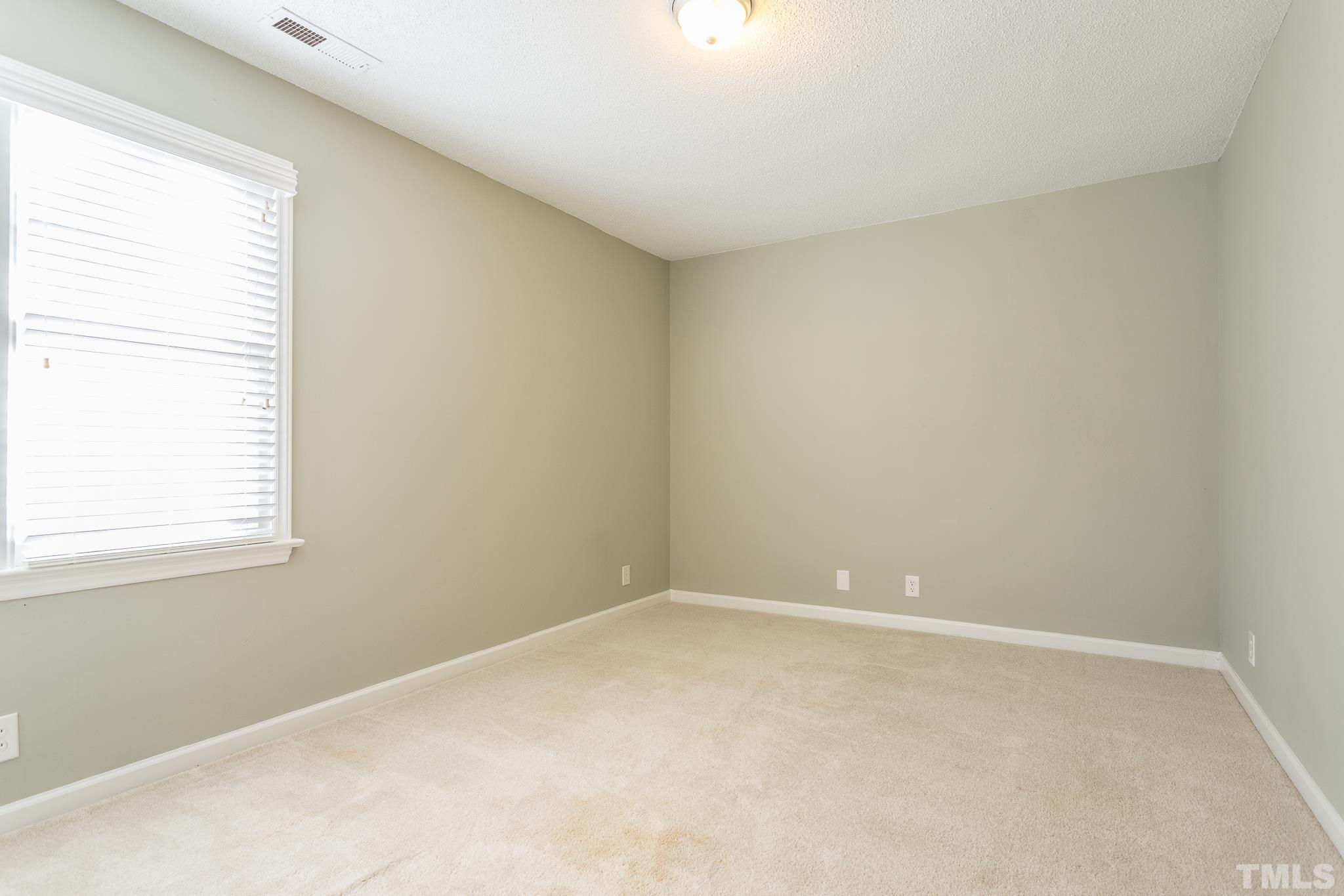 4428 Antique Lane Raleigh, NC 27616 - Photo 17 of 30 an empty room with a window