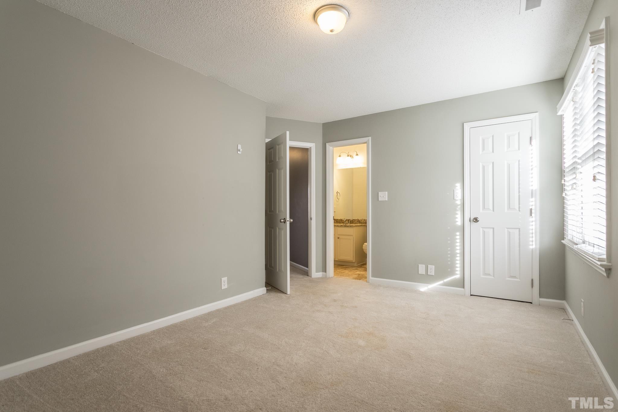 4428 Antique Lane Raleigh, NC 27616 - Photo 19 of 30 an empty room with closet and a window