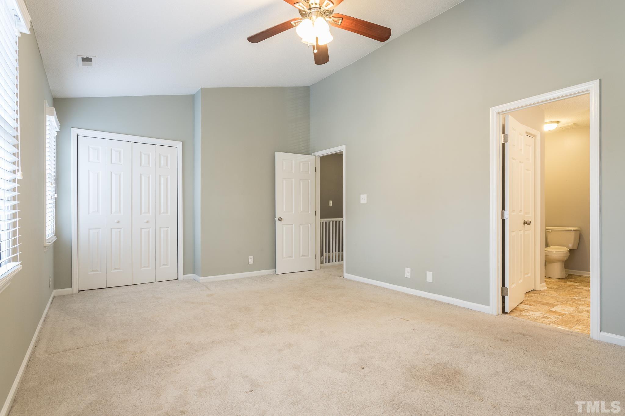 4428 Antique Lane Raleigh, NC 27616 - Photo 23 of 30 an empty room with fan and entrance