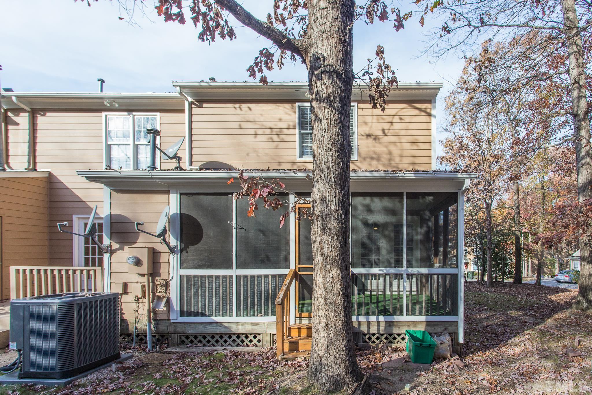 4428 Antique Lane Raleigh, NC 27616 - Photo 26 of 30 a view of a house with a large window and wooden fence