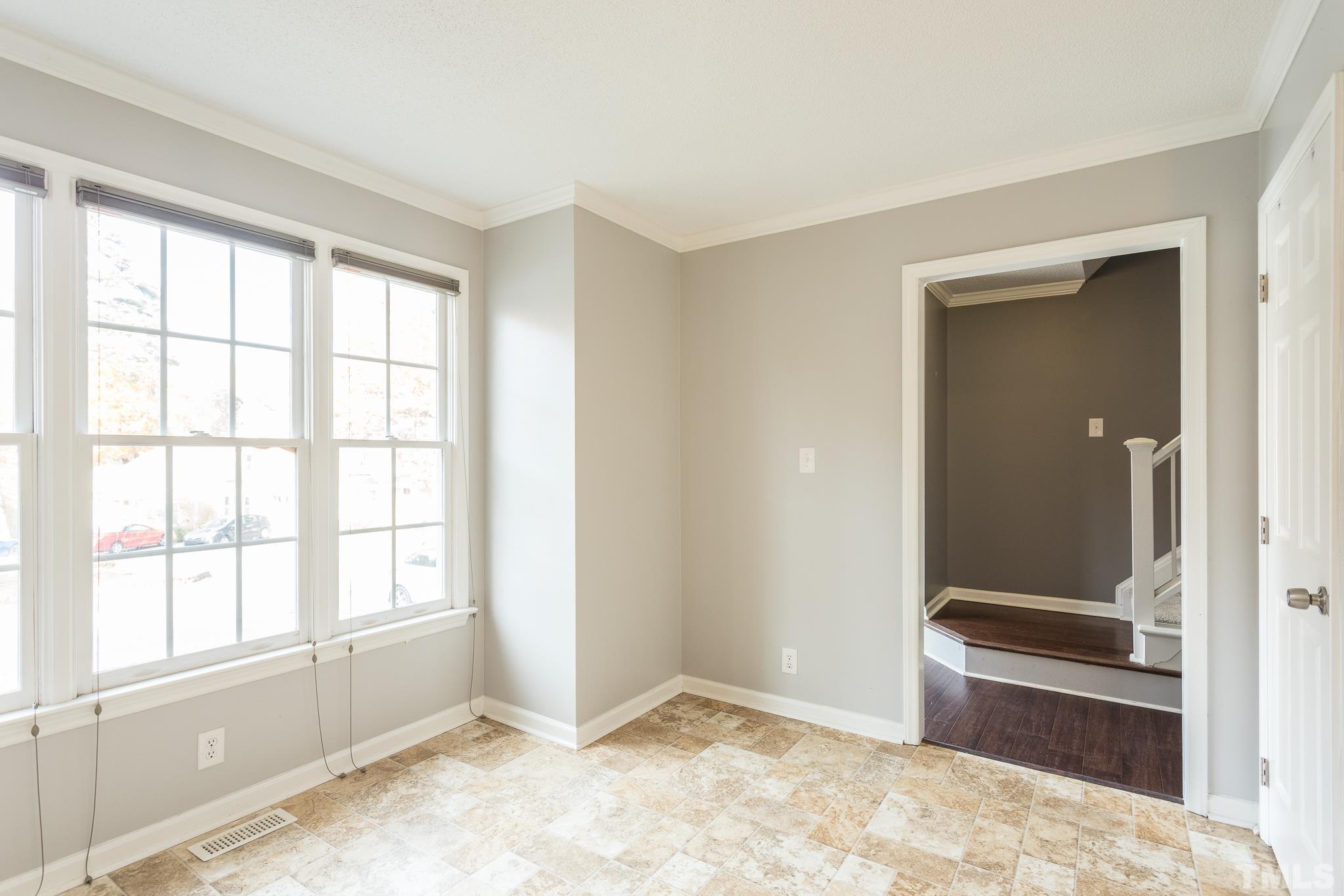 4428 Antique Lane Raleigh, NC 27616 - Photo 9 of 30 an empty room with windows