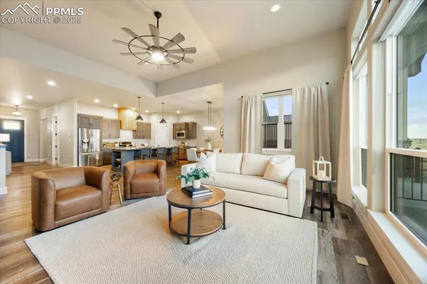 a living room with furniture and a large window