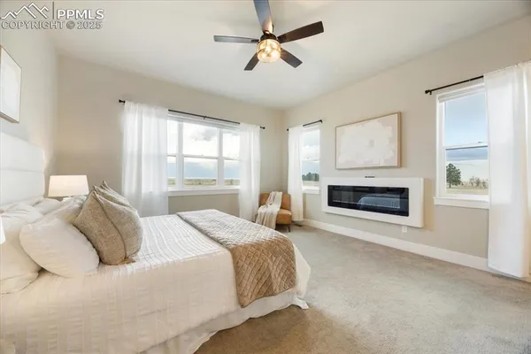 a bedroom with a bed and a fireplace