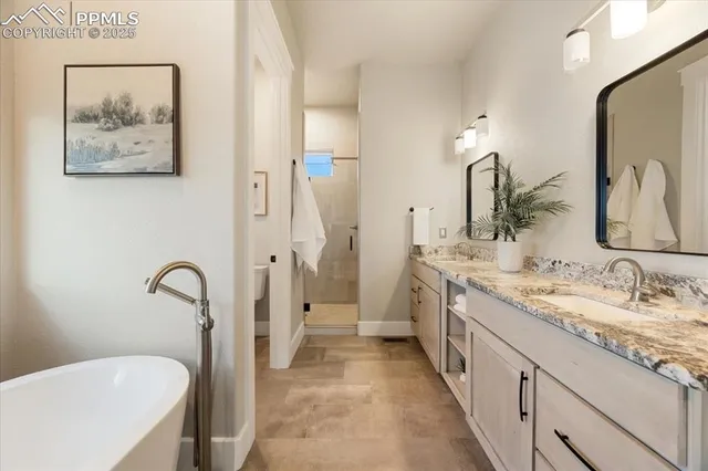a spacious bathroom with a double vanity sink and a mirror