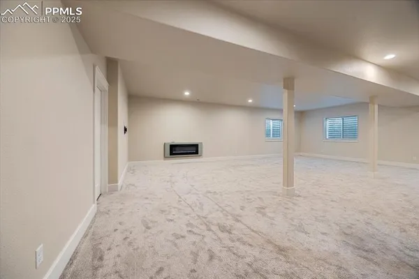 a view of empty room with a fireplace
