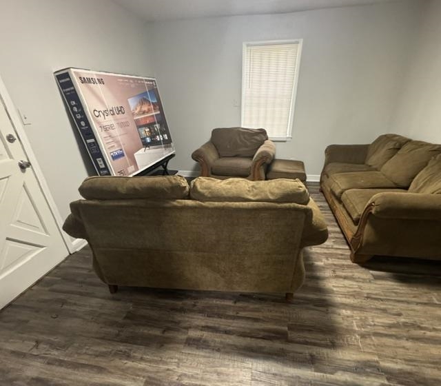 1370 East Alcy Road Memphis, TN 38106 - Photo 6 of 8 Spacious interior room featuring wood-finish flooring, light gray wall paint, and a window with blinds