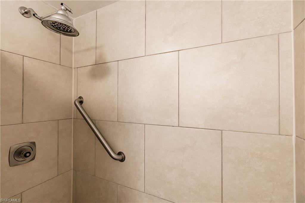 600 Neapolitan Way, Unit 152 Naples, FL 34103 - Photo 13 of 41 a bathroom with a shower
