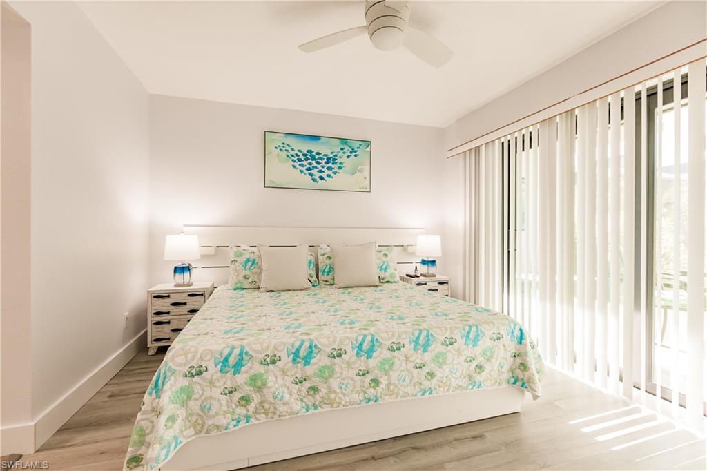 600 Neapolitan Way, Unit 152 Naples, FL 34103 - Photo 7 of 41 a bedroom with a bed and a window