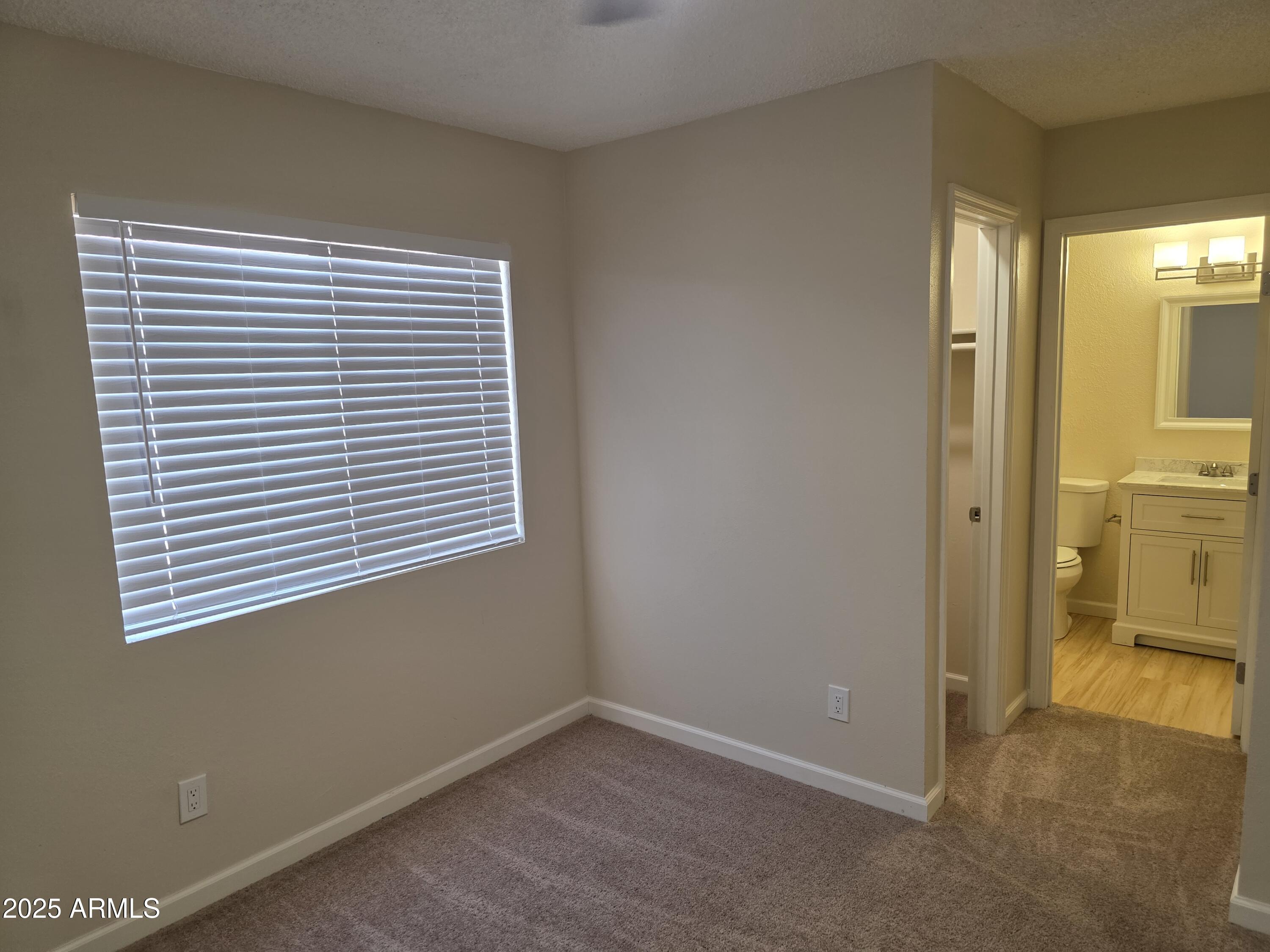 3511 East Baseline Road, Unit 1117 Phoenix, AZ 85042 - Photo 15 of 30 a view of a room that has a window in it