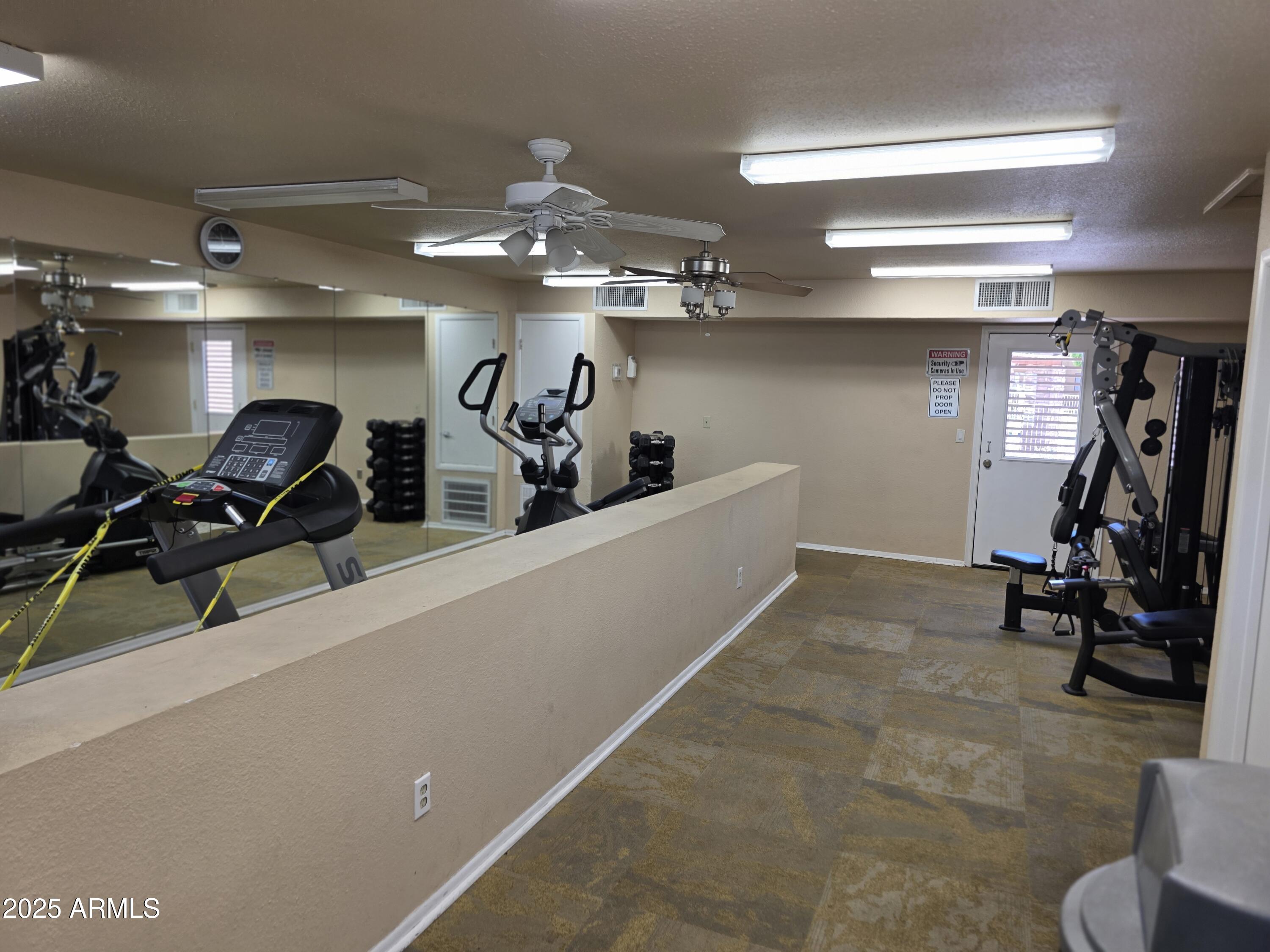 3511 East Baseline Road, Unit 1117 Phoenix, AZ 85042 - Photo 26 of 30 a view of a room with gym equipment