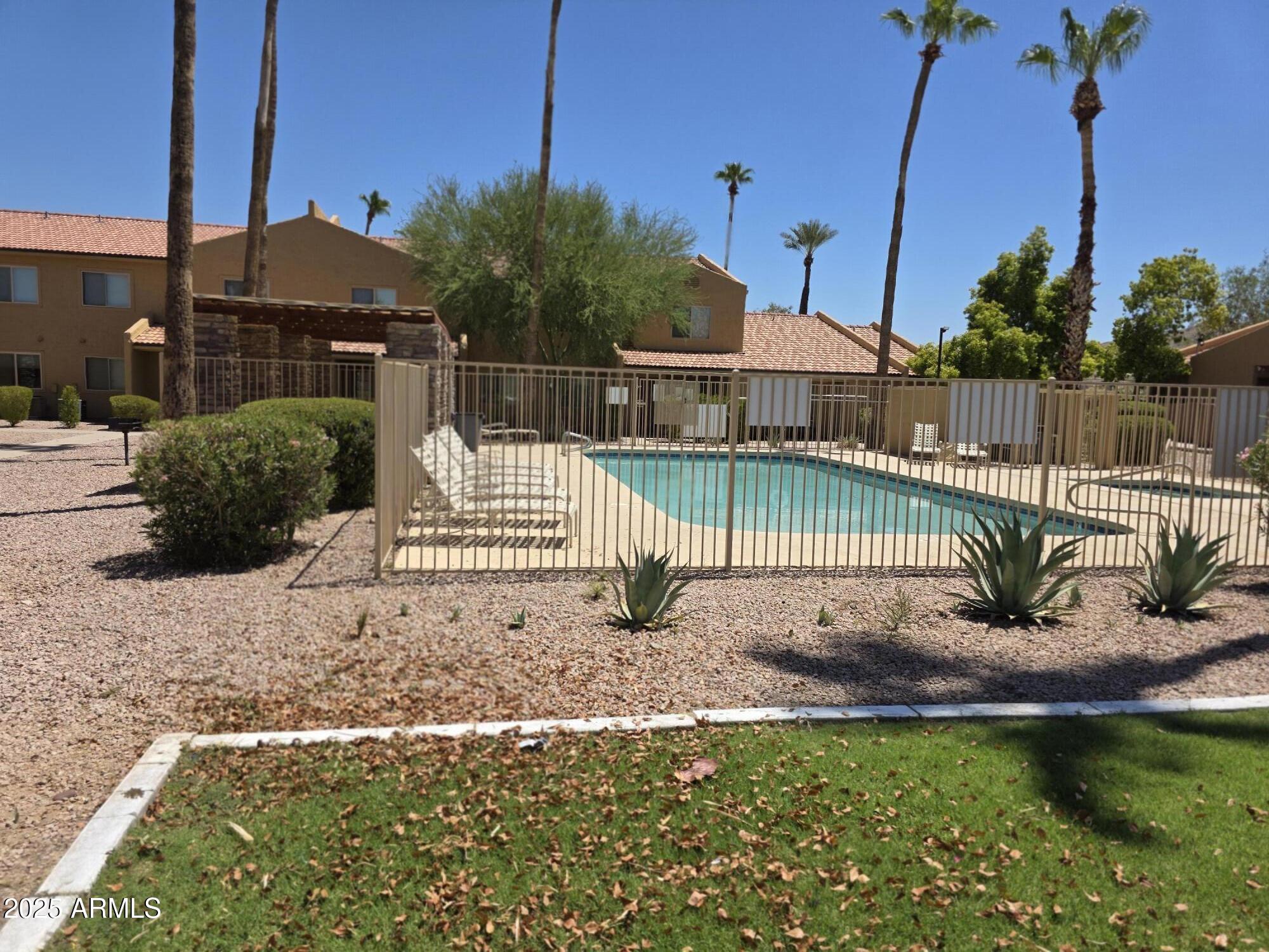 3511 East Baseline Road, Unit 1117 Phoenix, AZ 85042 - Photo 30 of 30 a view of a house with a yard