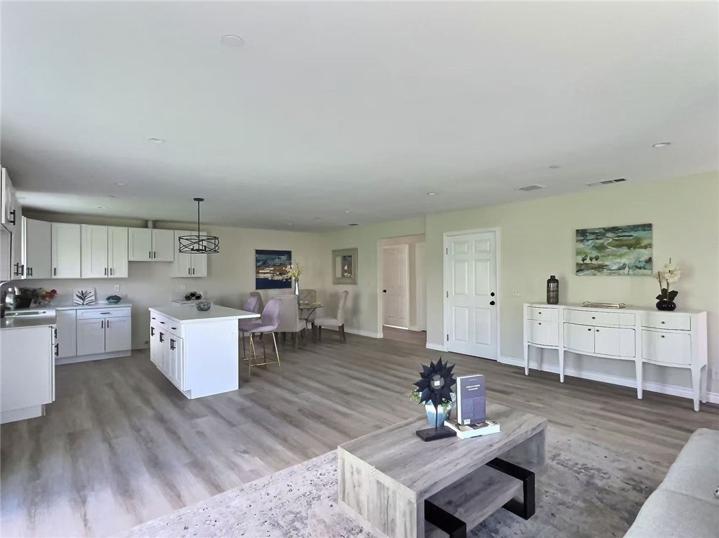 378 Rosa Parks Road Palm Springs, CA 92262 - Photo 3 of 9 a living room with furniture and wooden floor