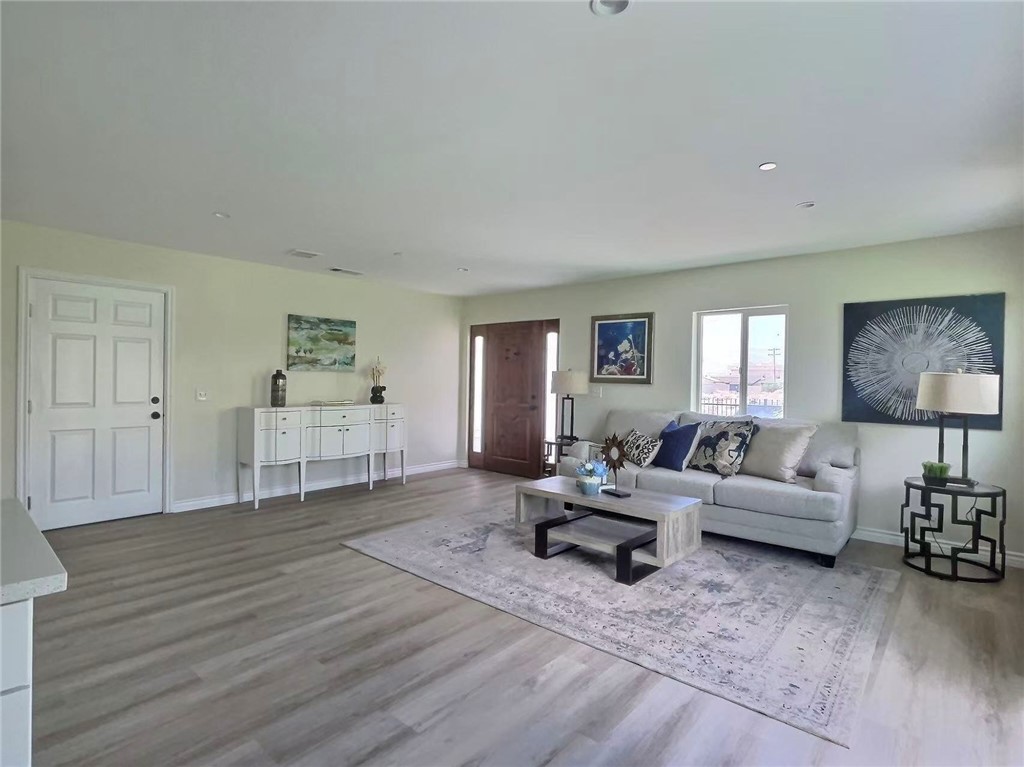 378 Rosa Parks Road Palm Springs, CA 92262 - Photo 4 of 9 a living room with furniture and a wooden floor