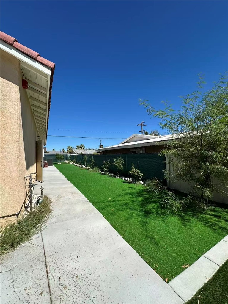 378 Rosa Parks Road Palm Springs, CA 92262 - Photo 7 of 9 a view of a backyard with potted plants