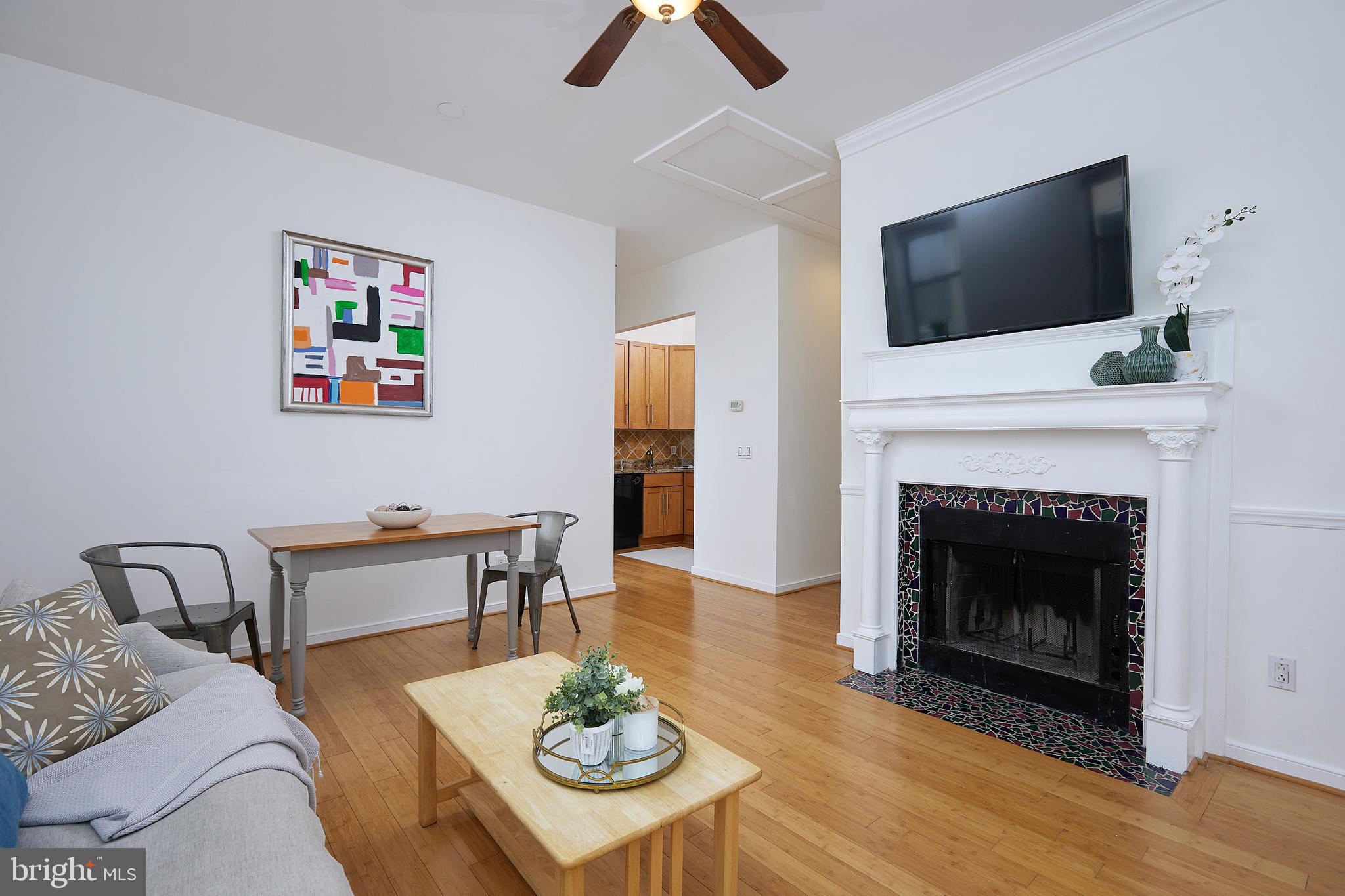 Open concept living-dining area with fireplace