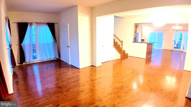 a view of hallway with wooden floor