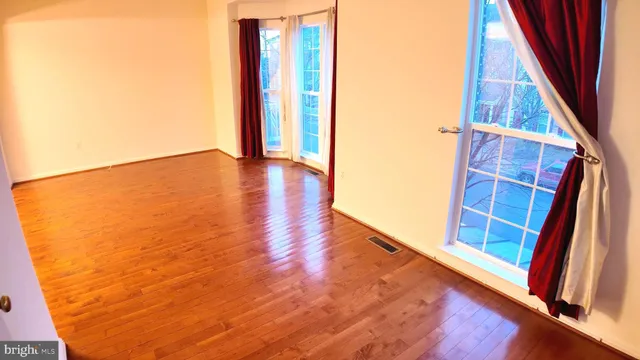 a view of front door and wooden floor