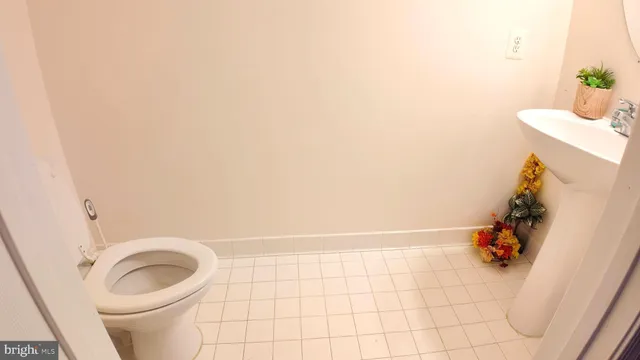 a bathroom with a toilet and a sink