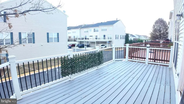 a view of a house with wooden deck