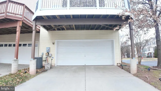 a front view of a house with a garage